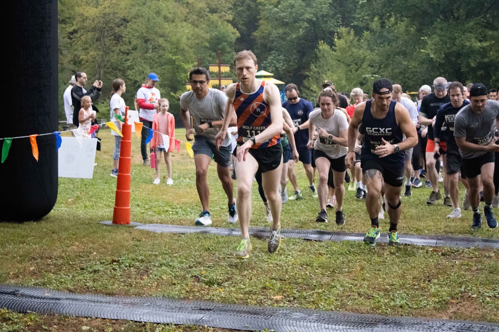 Runners bursting off the start line at the Fox Chapel 5K